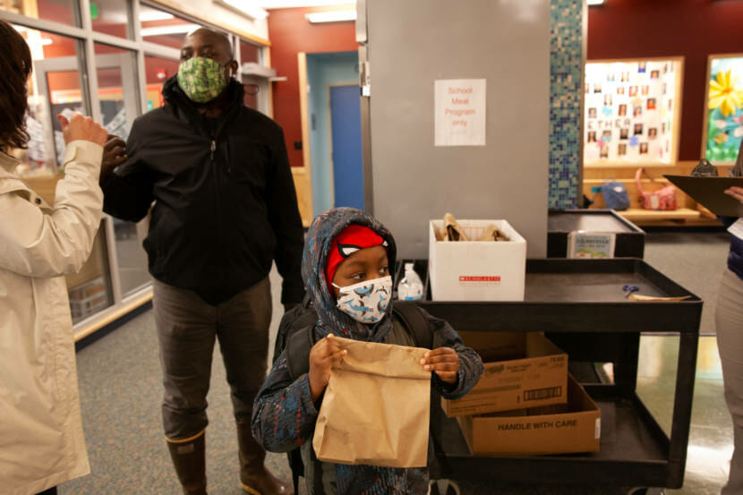 Gregory Francis looks across the cafeteria at Sayéik Gastineau Community School during his first day of in-person classes on Thursday, Jan. 14, 2020, in Juneau, Alaska. (Photo by Rashah McChesney/KTOO)