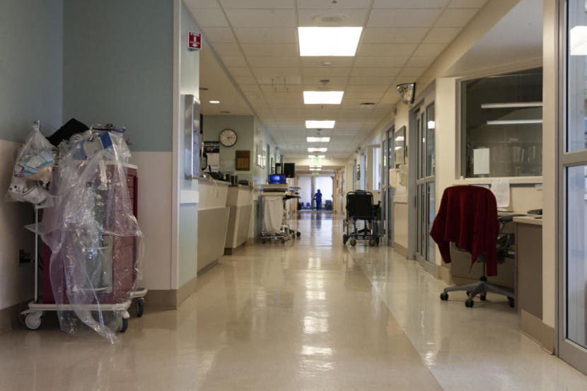 A mostly empty hospital hallway