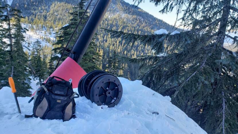 Backpack wheels by damaged Ptarmigan chairlift pole on Insane