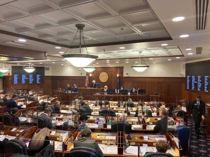 Alaska House Speaker Louise Stutes, on the dais in the center, presides over the House floor session on Feb. 18, 2021, in the Alaska State Capitol in Juneau. The House organized, including naming committee members of its standing committees, during the session. (Andrew Kitchenman/KTOO and Alaska Public Media via AP, Pool)