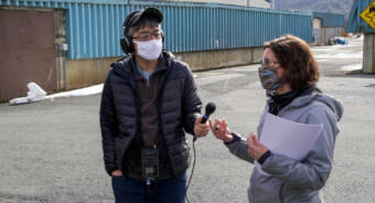 City and Borough of Juneau wastewater engineer Lori Sowa discusses wastewater treatment with KTOO reporter Jeremy Hsieh during a tour of the Juneau-Douglas Wastewater Treatment Plant on March 18, 2021. (Photo by Andrés Camacho/KTOO)