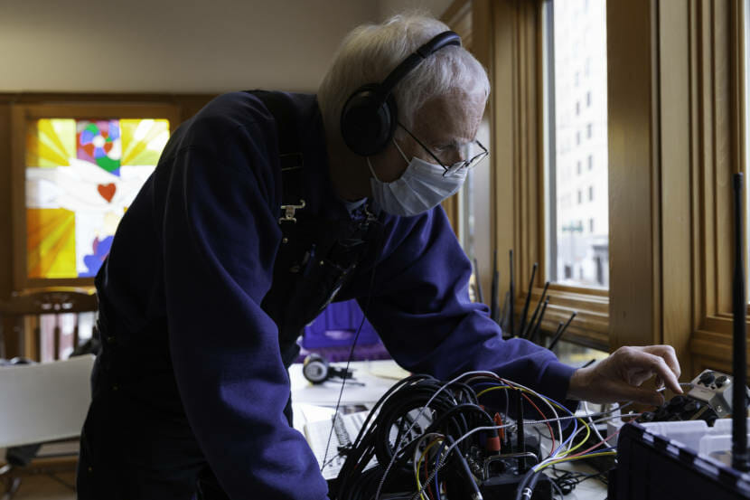 Tom Fullam monitors the audio coming in from dozens of cars and at least 30 microphones during a Choir from Cars meeting on Saturday, March 6, 2021 in Juneau, Alaska. (Photo by Rashah McChesney/KTOO)