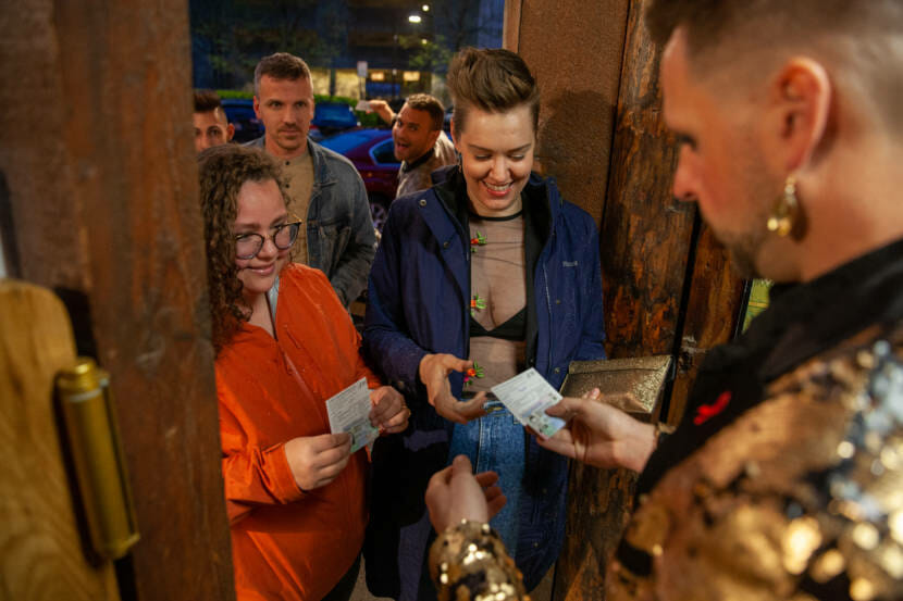 Abi Spofford shows her COVID-19 vaccination card to get into a live drag show on Saturday, May 22, 2021, in Juneau, Alaska. (Photo by Rashah McChesney/KTOO) 