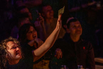 Audience members were asked to tip by throwing money into buckets by the stage or by tipping digitally during Juneau Drag's first in-person show in 15 months on Saturday, May 22, 2021, in Juneau, Alaska. (Photo by Rashah McChesney/KTOO) 