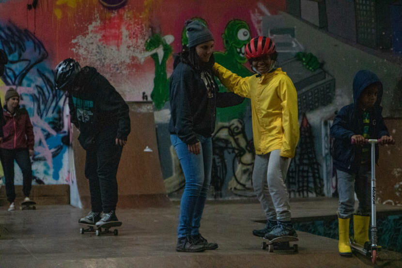 Kids from the Zach Gordon Youth Center learn how to skateboard at Juneau's first women and trans skateboarding session