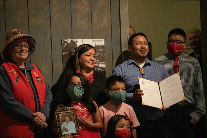 Martin Stepetin stands with his family holding House Bill 10. Alaska Gov. Mike Dunleavey signed the bill on June 8 at the Juneau-Douglas City Museum