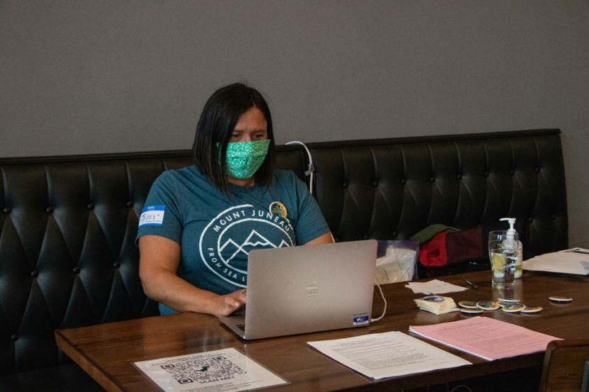 Tracy Balovich helps with the administration side of the COVID-19 vaccine clinic at Forbidden Peak Brewery