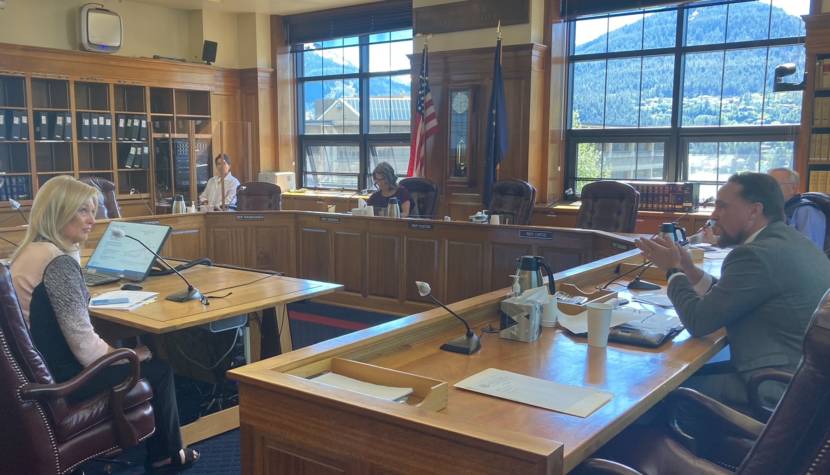 Lucinda Mahoney, commissioner of the Alaska Department of Revenue, left, listens to Rep. Ben Carpenter, R-Nikiski, right, during the House Finance Committee meeting on June 8, 2021, in the Alaska State Capitol in Juneau. (Photo by Andrew Kitchenman/KTOO and Alaska Public Media)