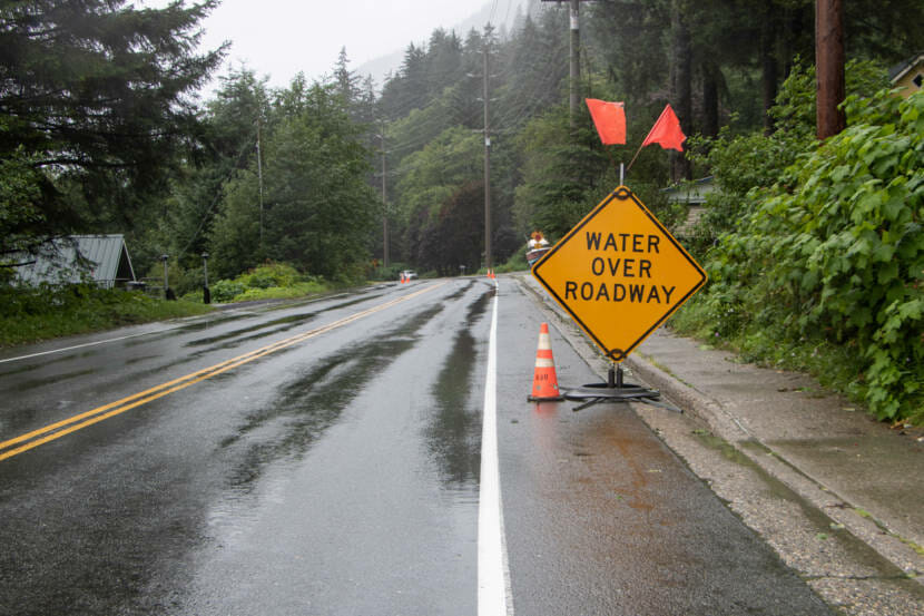 Water over roadway sign on Glacier Highway on August 13, 2021 in Juneau Alaska. (Photo by Lyndsey Brollini/KTOO)