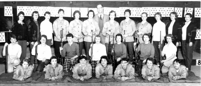 The 1958-'59 high school rifle club poses for a yearbook photo. 