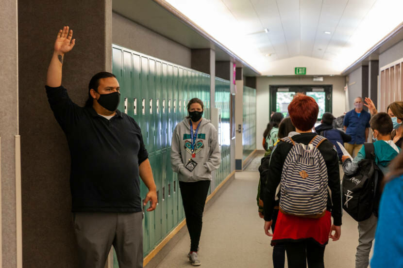 Frank Henry Kaash Katasse guides students to his classroom for a Tlingit class at Dzantik'i Heeni middle school on the first day of school on Monday, August 16, 2021, in Juneau, Alaska. (Photo by Rashah McChesney/KTOO)