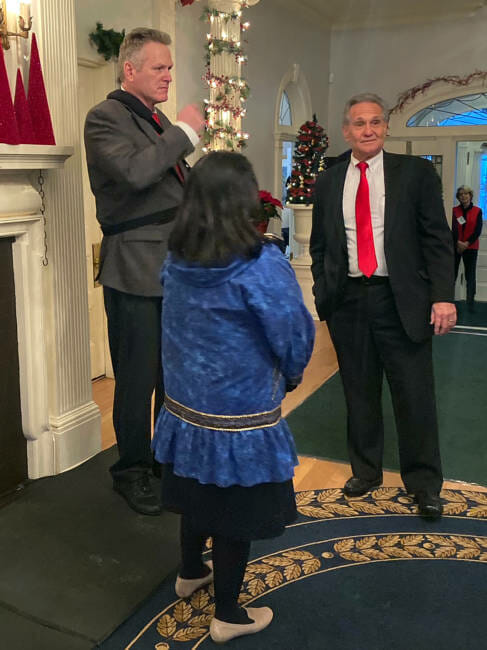 Alaska Gov. Mike Dunleavy, Lt. Gov. Kevin Meyer and Rose Dunleavy talk before the open house at the Governor’s Mansion in Juneau on Dec. 7, 2021. (Photo by Andrew Kitchenman/KTOO and Alaska Public Media)