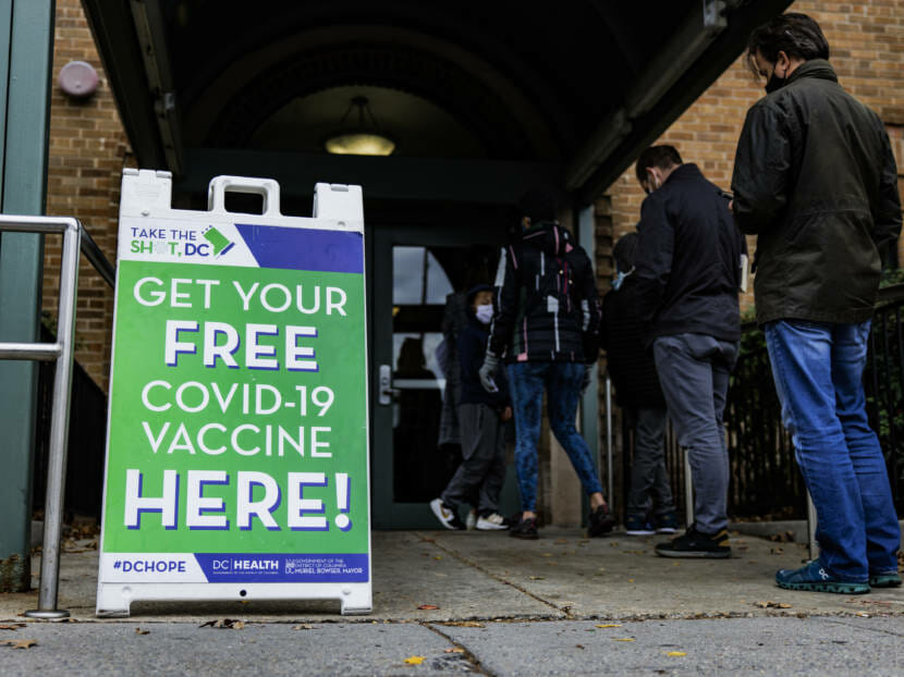 People line up outside a free COVID vaccine clinic in Washington, DC
