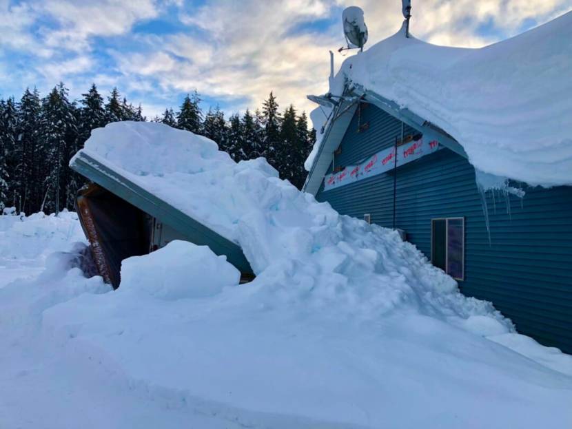 The front of a building buried in deep snow