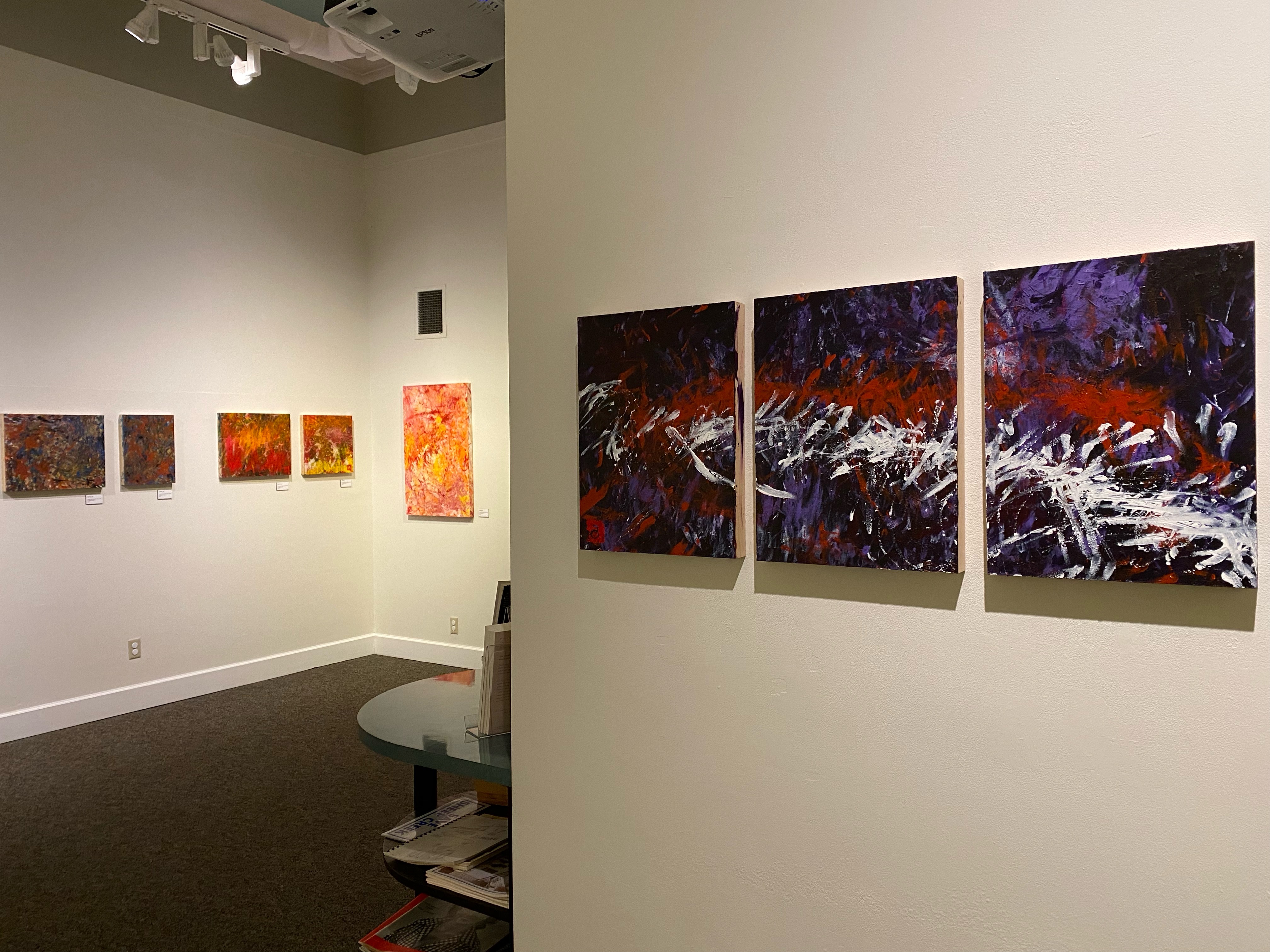 A new exhibit at the Juneau-Douglas City Museum features paintings created by local artist Avery Skaggs. Skaggs is in a wheelchair and is non-verbal, but expresses himself through art. (Photo by Bridget Dowd / KTOO)