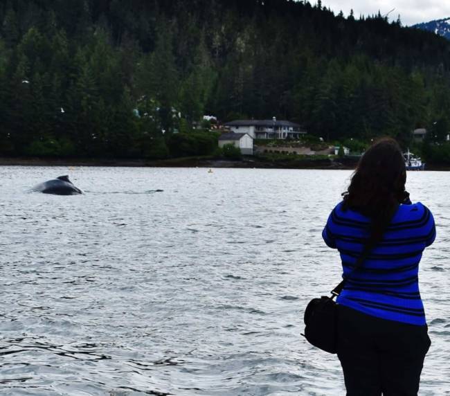 Gabrille Lopez photographs a humpback whale in Auke Bay.