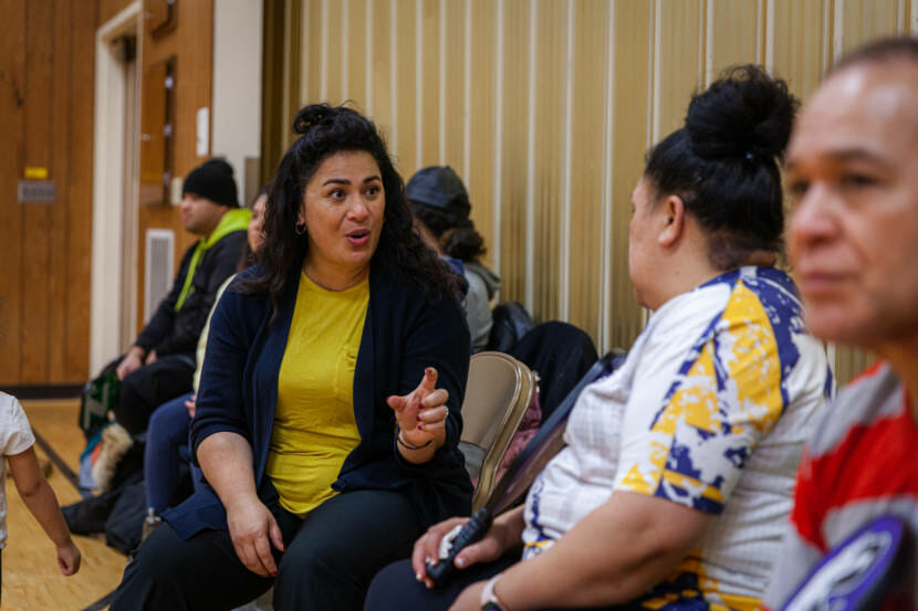 Melehoko Pauu Ma'ake talks to a friend during her family's regular meetup to play pickleball on Saturday, Jan. 22, 2022, in Juneau, Alaska. Most of the family is Tongan and they've been trying to reach family and friends in the island nation after a volcanic eruption and tsunami. (Photo by Rashah McChesney/KTOO)