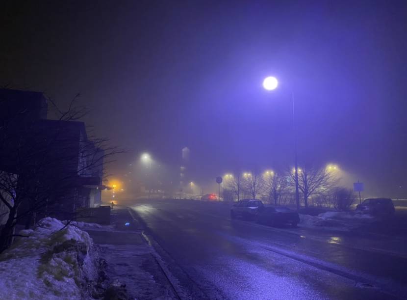 A street light near the Juneau Public Library glows purple on Sunday, Jan. 23, 2022.