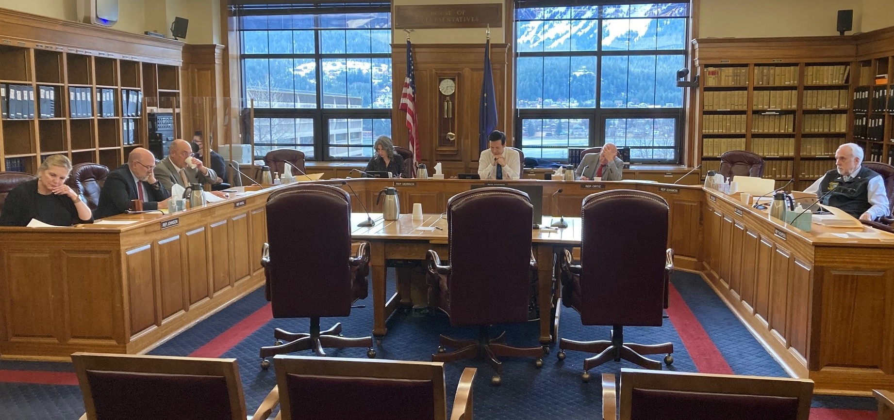 Alaska House Finance Committee members review documents during public testimony on the committee's draft budget on March 4, 2022, in the Alaska State Capitol in Juneau, Alaska. Pictured are Reps. DeLena Johnson, R-Palmer; Adam Wool, D-Fairbanks; Andy Josephson, D-Anchorage; Kelly Merrick, R-Eagle River; Neal Foster, D-Nome; Dan Ortiz, I-Ketchikan; and Bart LeBon, R-Fairbanks. 