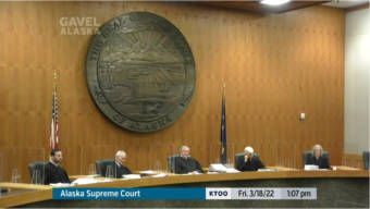 The Alaska Supreme Court hears oral arguments in three appeals of a Superior Court judge's ruling on legal challenges to the new state legislative district map on March 18, 2022, in the court's chambers in Anchorage. Pictured, from left, are Justice Dario Borghesan, Senior Justice Warren Matthews Jr., Chief Justice Daniel Winfree, Senior Justice Robert Eastaugh and Justice Jennifer Henderson. (Gavel Alaska screen capture)