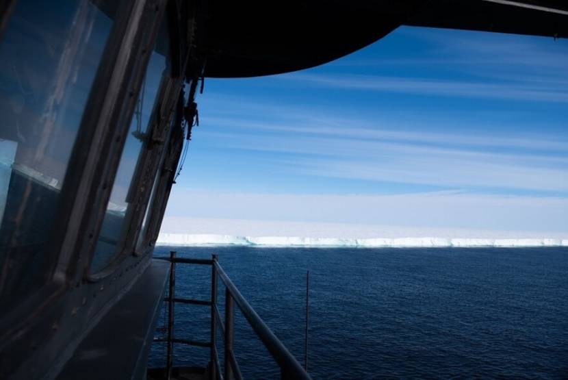 An ice shelf seen from the deck of a ship