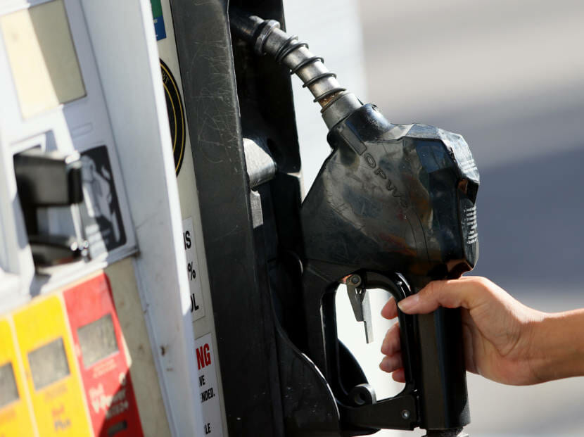 A hand on a gas pump
