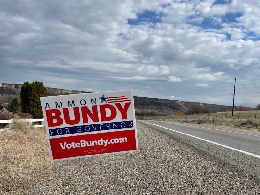 A campaign sign for Ammon Bundy beside a rural road
