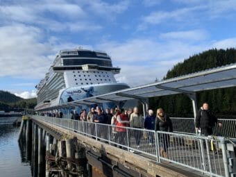 Passengers leaving a large cruise ship