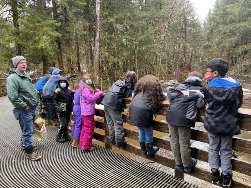 Juneau third grade teacher, Geoffrey Wyatt guides his class through an outdoor lesson on April 1, 2022.