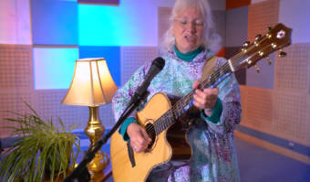 Robin Hopper performs on her guitar at the KTOO studios during a Red Carpet Concert session.