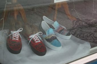 The students' pairs of Vans displayed in a window