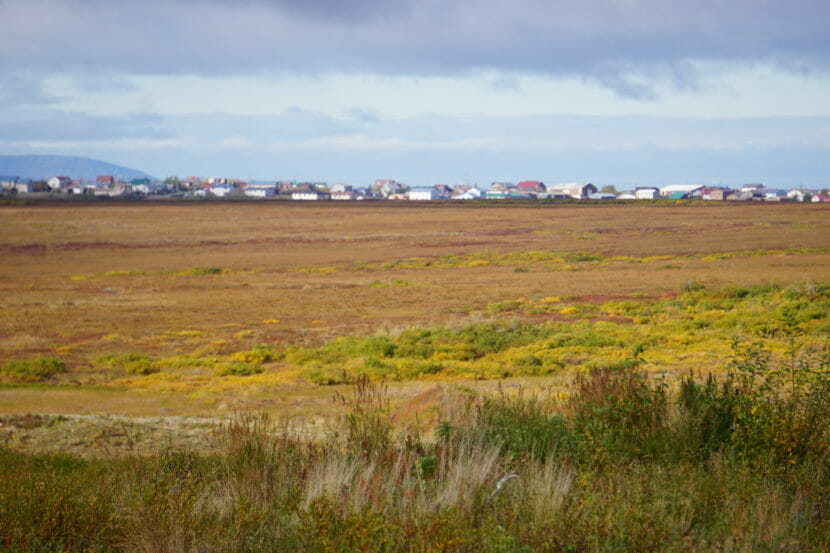 Nome seen in the distance across an expanse of open ground