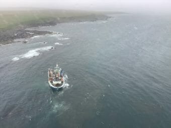 A fishing boat aground very close to shore
