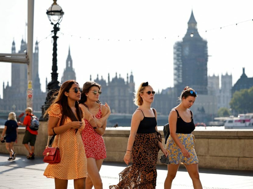 People walking in London in casual summer clothes