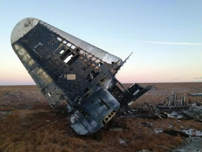 The broken-off tail of an old plane lying on the tundra