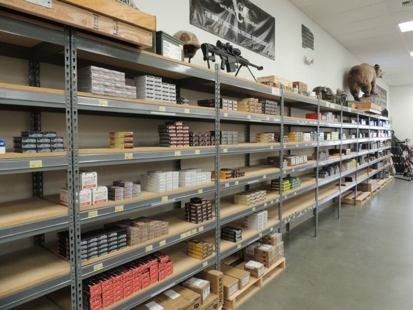 Shelves in a gun shop, with many empty spaces