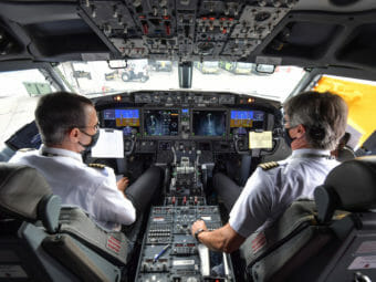 Two pilots in the cockpit of a jet