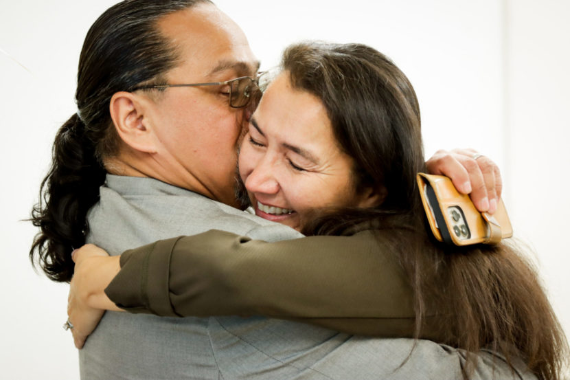 Mary Peltola hugs her husband