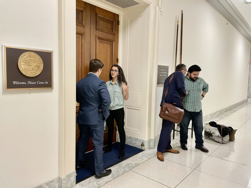 Mary Peltola and three men stand in a Capitol hallway
