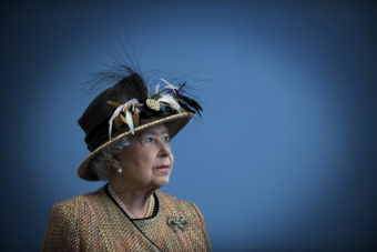 A portrait of Queen Elizabeth wearing an extensively feathered hat