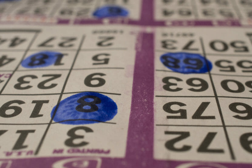 Close-up photo of a bingo card with several numbers marked in blue