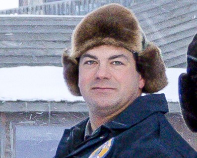 A photo of a man in a beaver hat.