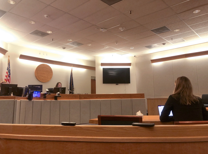 A nearly empty courtroom.