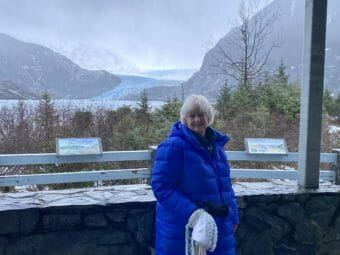 Laurie Craig poses in front of the Mendenhall Glacier.