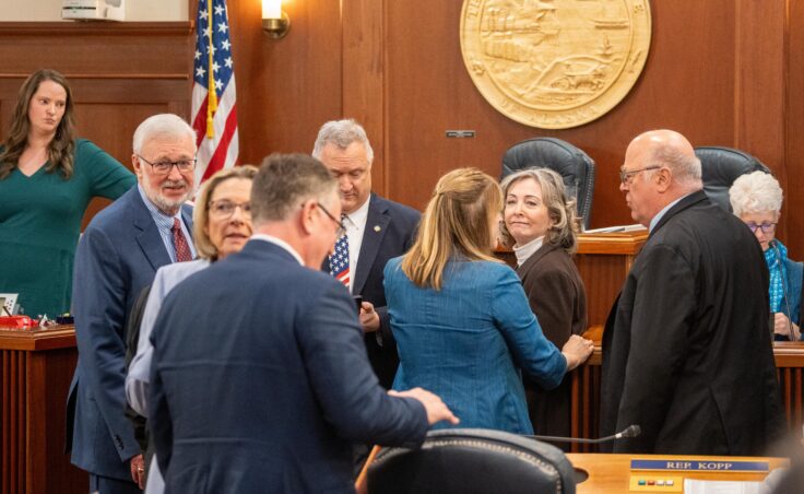 Senators and representatives speak with one another on the floor of the Alaska House of Representatives during a joint session on May 14, 2025.