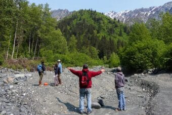 Chilkat Indian Village environmental staff and outside researchers stand on the 23 mile slide area during a site visit in June.