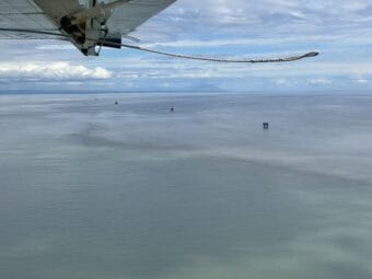 aerial view of water with drilling rigs