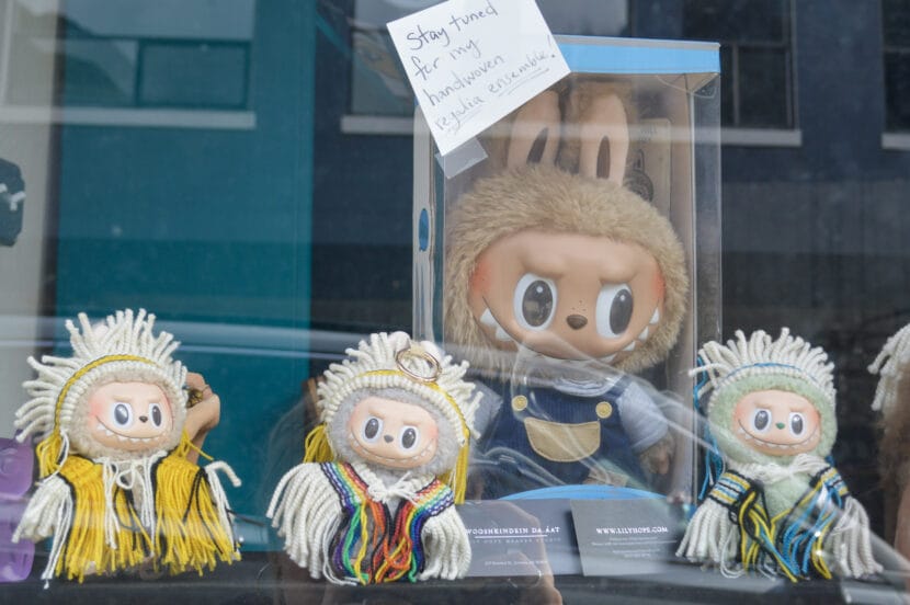 Three Labubus in Ravenstail weaving on display, while a gigantic fourth one awaits his, at master weaver Lily Hope's studio on Sept. 12, 2025. (Photo by Yvonne Krumrey/KTOO)