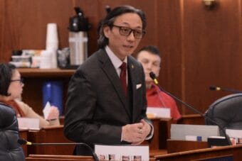 a man addresses a meeting room
