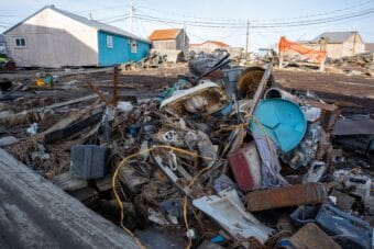 Debris sits in a pile in storm-ravaged Kipnuk, Alaska on Oct. 19, 2025, a week after the remnants of Typhoon Halong brought catastrophic flooding and hurricane-force winds to the village.